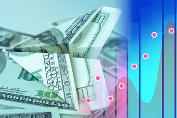 Airplane from the dollar on the background of the stock chart. The growth of the dollar in the course of trading. Currency market. Earnings on currency fluctuations.