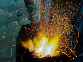 Blacksmith fire, in a medieval fair, Onteniente, Spain