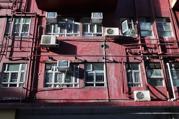 Bright sunlight shine on pink building in Hong Kong