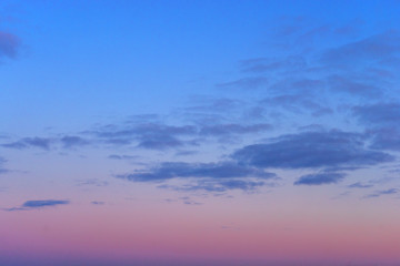 Beautiful clear, morning sky at sunrise, natural background. Soft pink clouds.