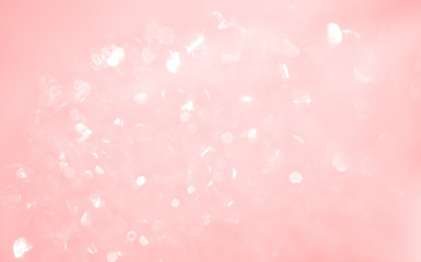 Abstract defocused shiny glowing background. Pink color glitter texture. Beauty romance pattern