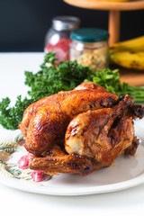 Food concept homemade Roasted, Grilled Whole organic chicken on white ceramic plate