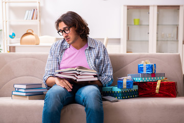 Young male student preparing for exams during Christmas