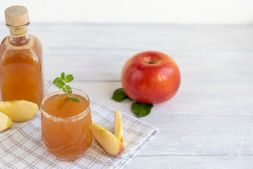 Freshly squeezed apple juice on a white background. Useful vitamin, antiviral drink.
