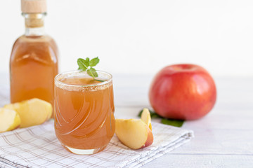 Freshly squeezed apple juice on a white background. Useful vitamin, antiviral drink.