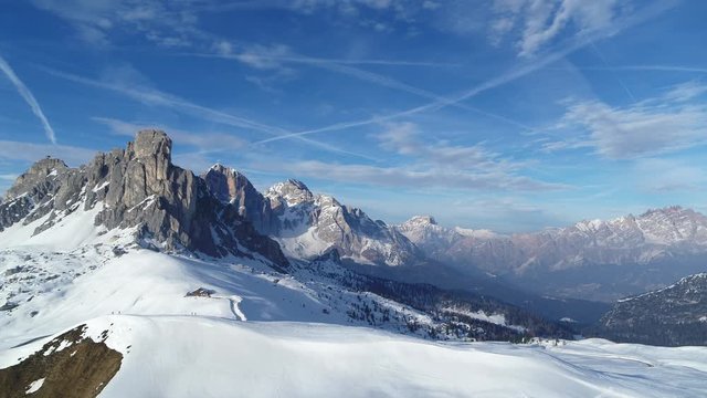 Wide epic winter landscape in the Alps. Aerial of dolomites on Passo Giau in 4K