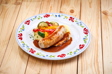 sausage with grilled vegetables and sauce