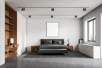 White and wooden bedroom with poster and table