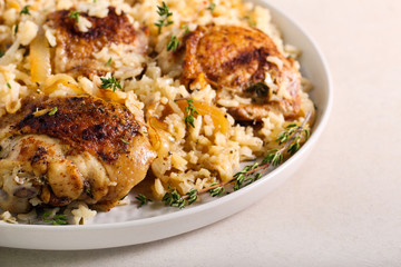 Thyme chicken thighs with rice,