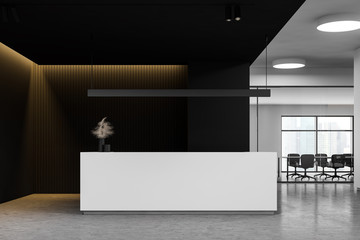 Reception in black office with meeting room