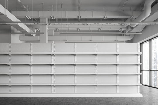 Empty shelves in white supermarket