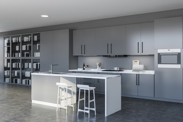 Gray kitchen with bar and bookcase