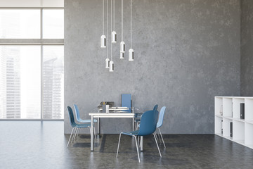 Concrete loft office interior with blue chairs