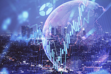 Financial graph on night city scape with tall buildings background double exposure. Analysis concept.