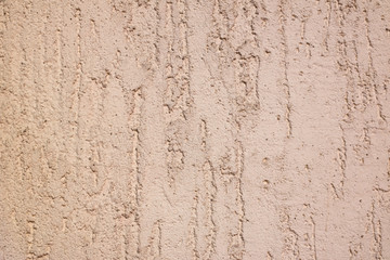 Scratched pink beige stucco outdoor wall background