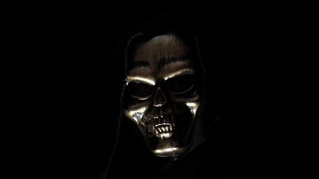 Man in a skeleton mask in the dark