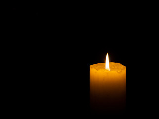 Coarse candle lit right with black background