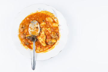 Cooked dish on a plate isolated on white background