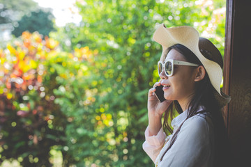 Model talking on the phone on a natural background