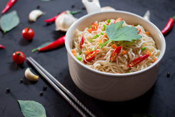 instant noodles in the bowl on dark background