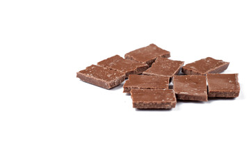 Chocolate cubes isolated on white background.Copy space