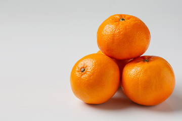 Fresh oranges on a white background