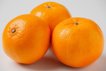 Fresh oranges on a white background