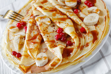 a stack of freshly cooked sweet crepes