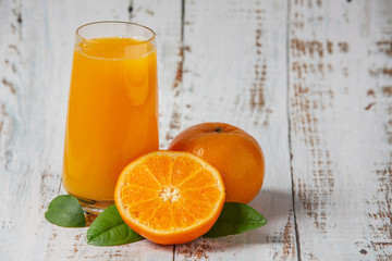 Fresh orange juice in a glass and fresh orange