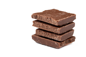 Chocolate cubes isolated on white background.Copy space