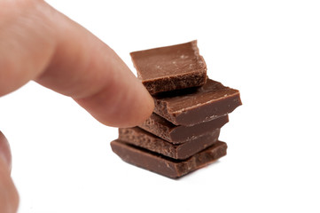 Chocolate cubes isolated on white background.Copy space