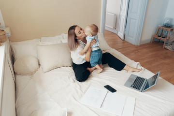 Business mom takes a break. Multi-tasking, freelance and motherhood concept