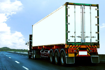 White Truck on highway road with  container, transportation concept.,import,export logistic industrial Transporting Land transport on the asphalt expressway againt blue sky