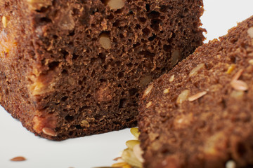 fresh bread with various seeds (pumpkin, dried apricots, flax, sunflower, sesame, prunes) is...