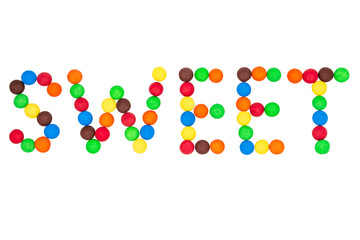     The inscription sweetness is laid out with colored candies