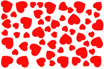 Small and large hearts cut out of paper are laid out on a white background