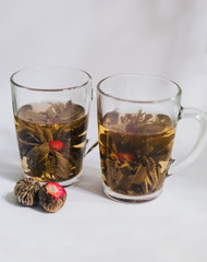 Cups of aroma flowers tea, magic tea, blossom tea