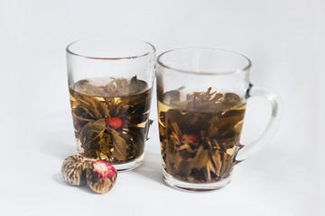 Cups of aroma flowers tea, magic tea, blossom tea