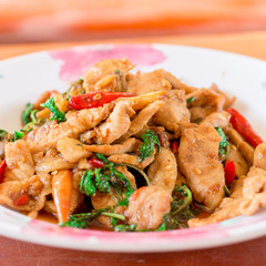 Rice topped with stir-fried pork and basil