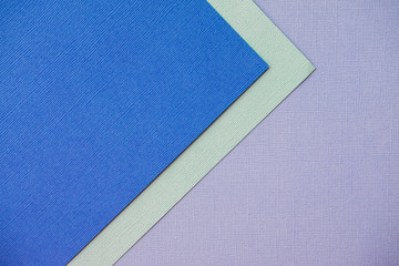 Mixing blue and turquoise design paper. The view from the top.