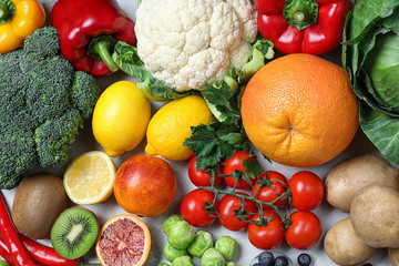 Different products rich in vitamin C on table, flat lay