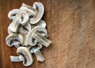 Mushrooms on the wooden desk with place for text.
