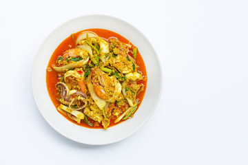 Fried seafood with curry powder on white