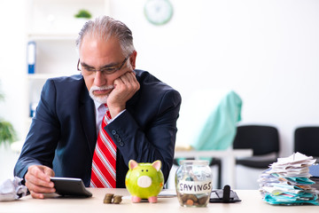 Old male accountant in budget planning concept