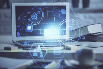 Computer on desktop with social network hologram. Multi exposure. Concept of international people connections.