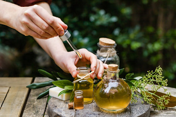 Concept of natural organic oil in cosmetology. Moisturizing skin care and aromatherapy.  Laboratory...