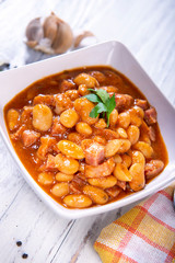 Baked beans in tomato sauce with chopped sausage