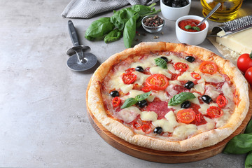 Hot delicious pizza Diablo on grey table