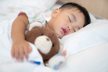 Asian children sleep in hospital