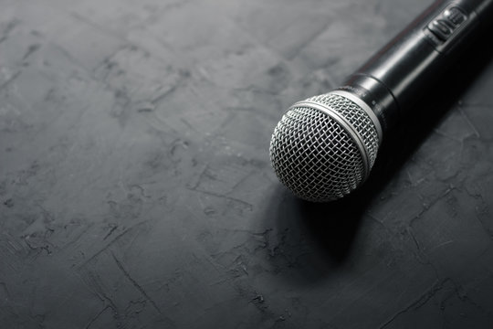 Microphone on a wooden black table